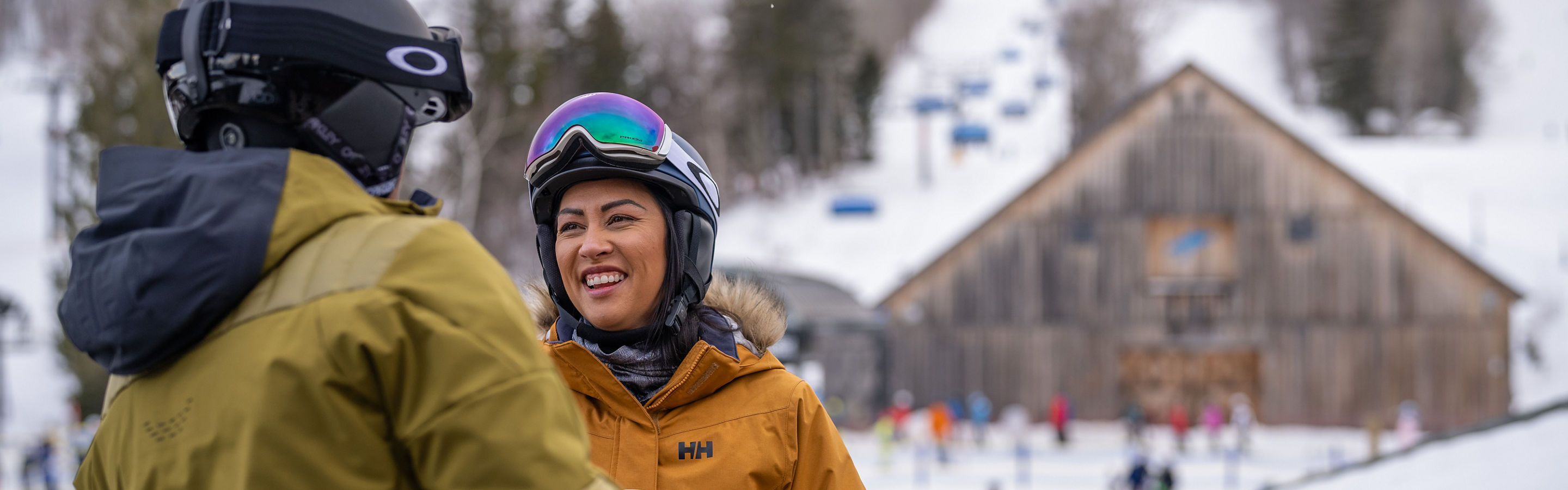 Couple Smiles on Station Tap Room Deck Overlooking Bluebird Barn at Mount Snow