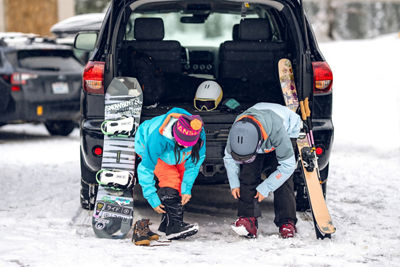 Friends Putting on Gear in the Parking Lot at Stevens Pass