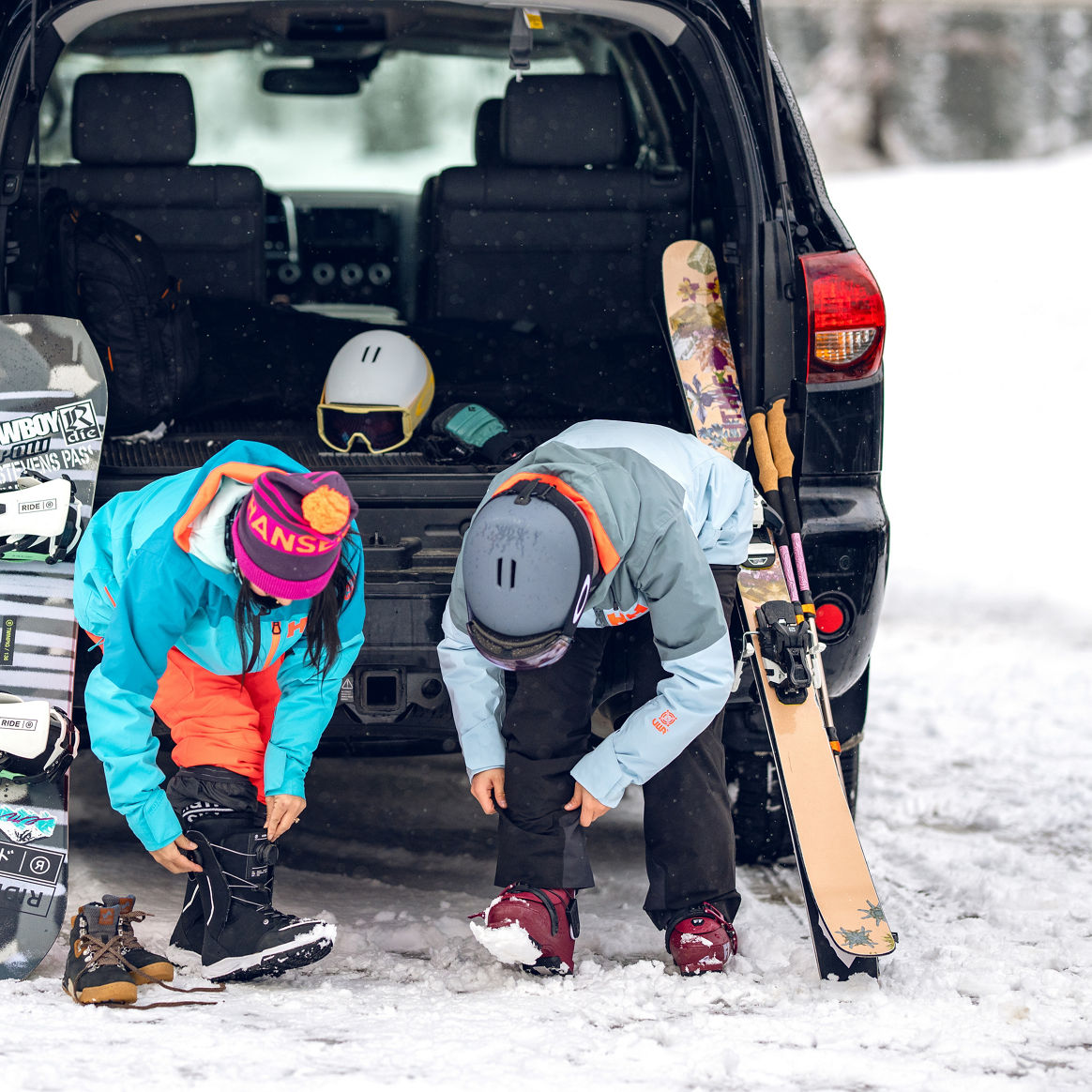 Friends Putting on Gear in the Parking Lot at Stevens Pass
