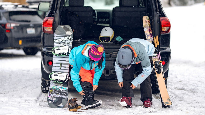 Friends Putting on Gear in the Parking Lot at Stevens Pass