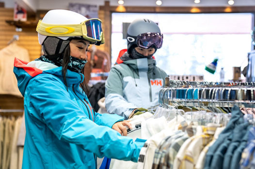 Resort Guests Browsing Retail at Fall Line Sports at Stevens Pass