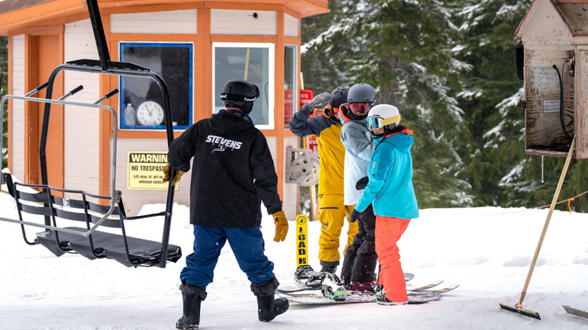 Resort Guests Prepare to Load a Chairlift at Stevens Pass