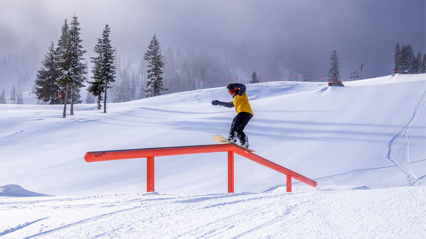 Snowboarder Hitting a Rail at the Terrain Park at Stevens Pass