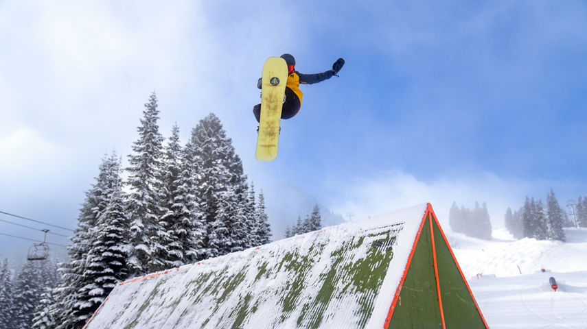 Snowboarder Jumping Off a Ramp at Stevens Pass