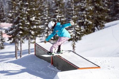 Snowboarder Hitting a Rail at the Terrain Park at Stevens Pass