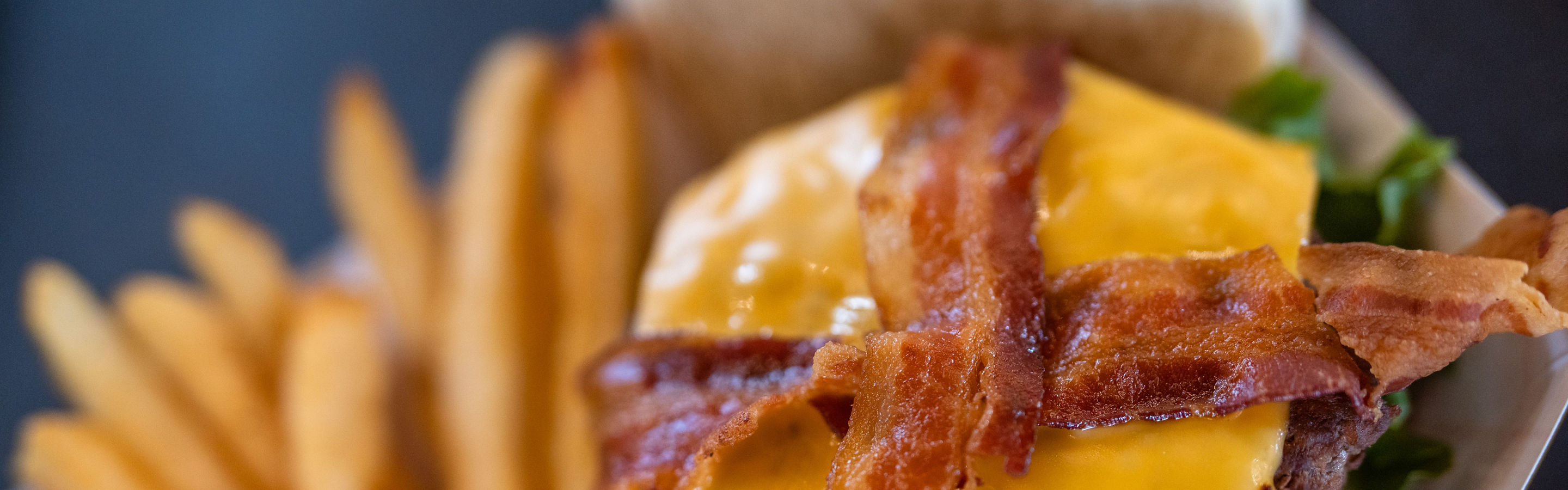 Close Up of Bacon Cheeseburger and Fries at Sugar House
