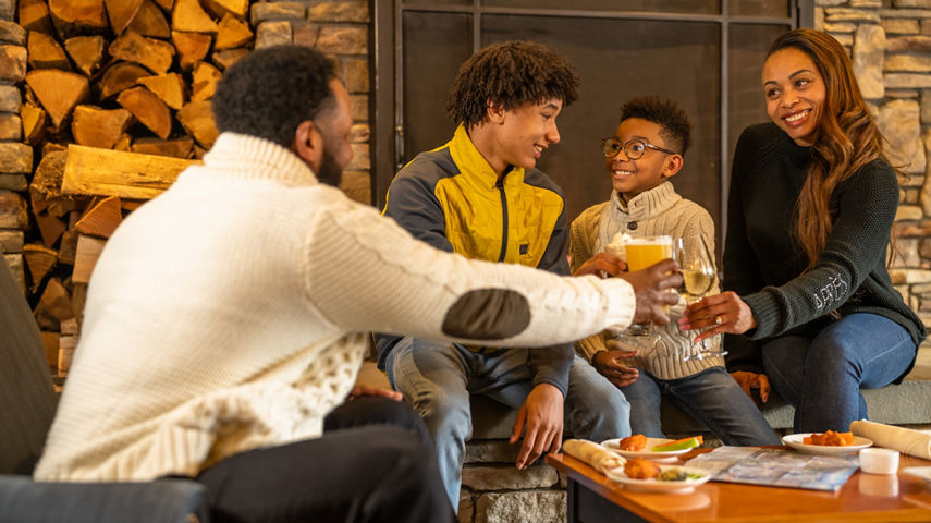 Family Enjoys Hot Cocoa and Drinks at the Lobby Bar at Jackson Gore Inn after Ski Trip