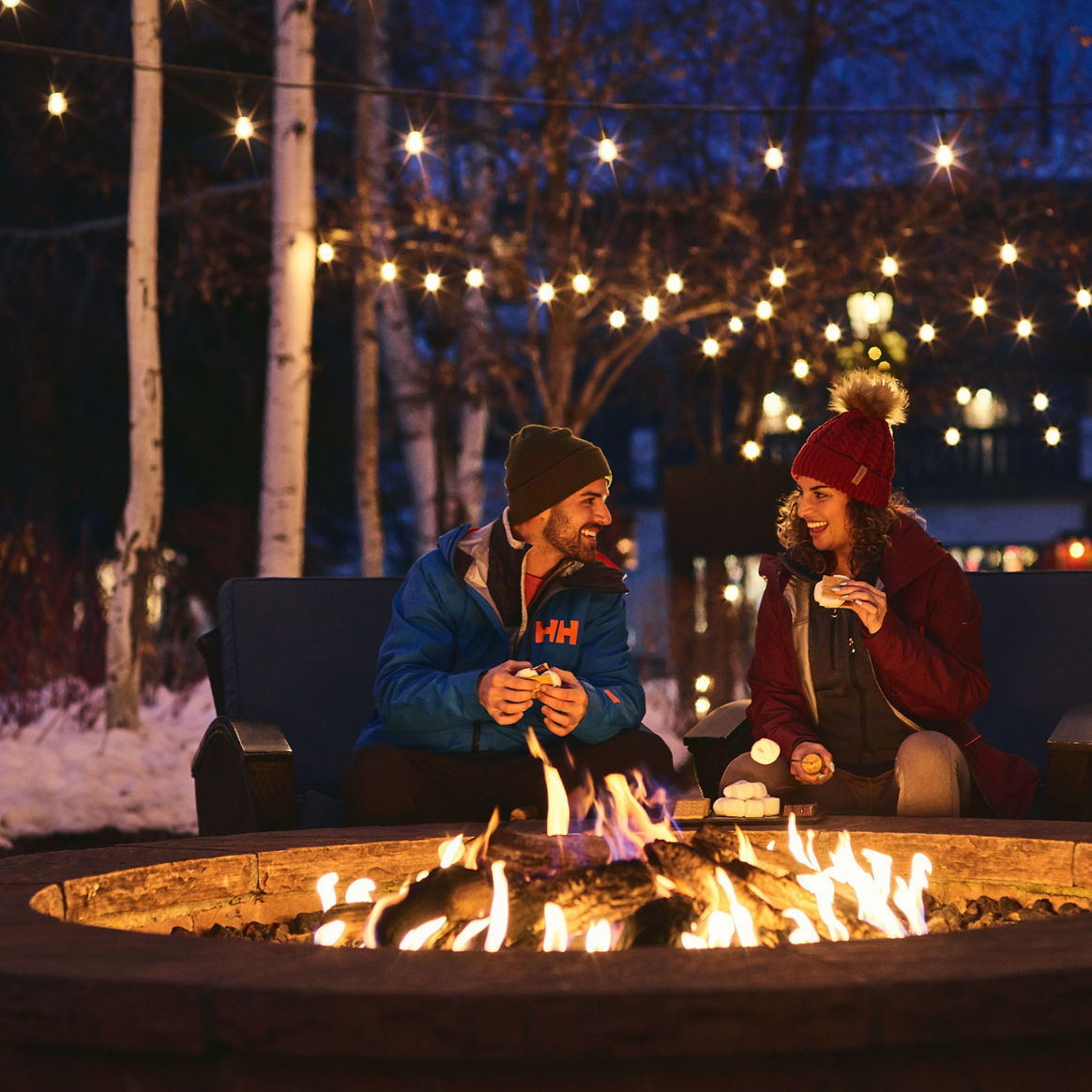 Couple eats smores at firepit at The Lodge at Vail