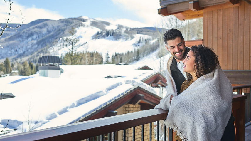 Couple on balcony at The Lodge at Vail