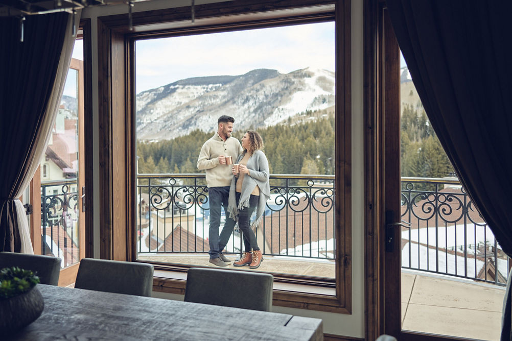 Couple enjoys balcony at The Arrabelle