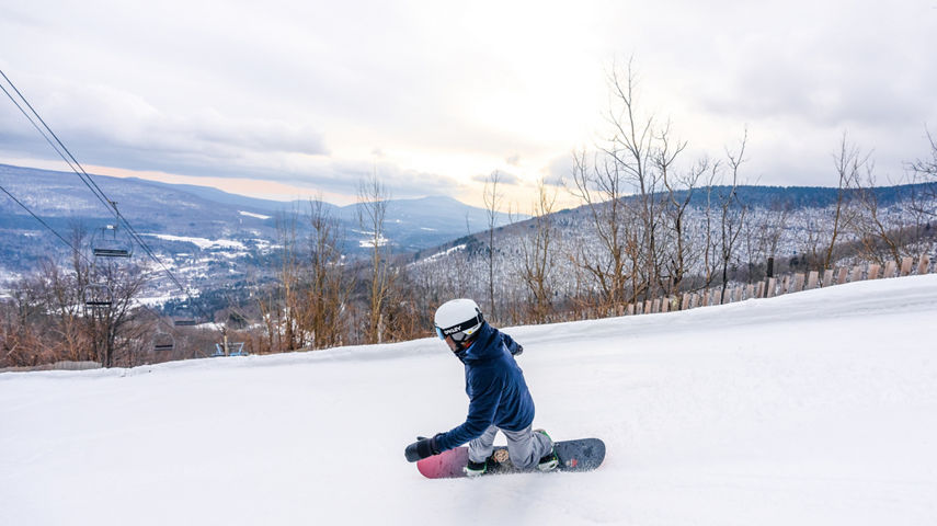 Scenic View of a Snowboarder Hitting a Run at Hunter