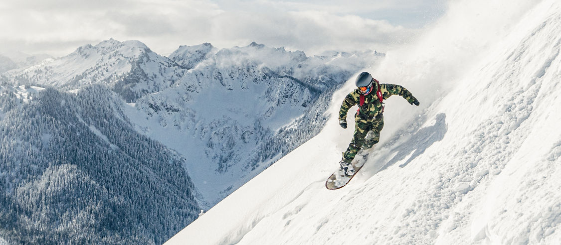 Snowboarder Riding Advanced Terrain at Stevens Pass