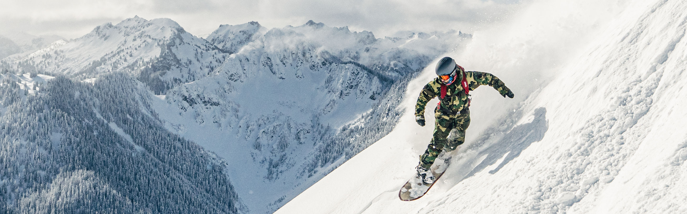 Snowboarder Riding Advanced Terrain at Stevens Pass