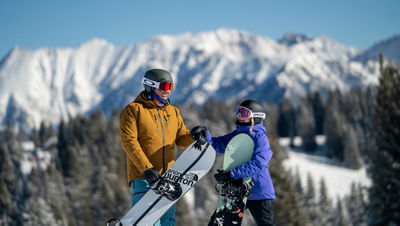 Boarders Enjoy View of Gore Range in Vail, CO