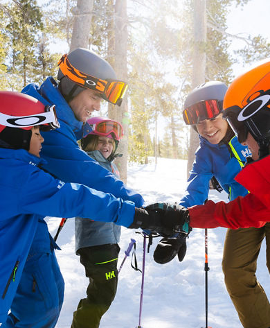 Older children skiing with an instructor