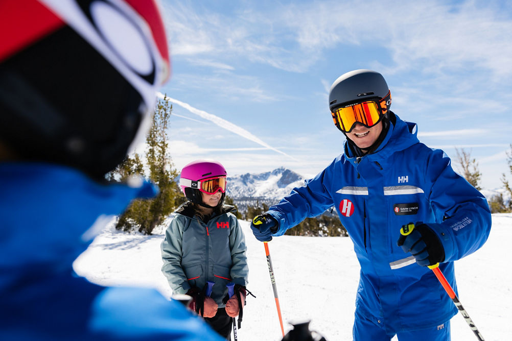 Older children skiing with an instructor