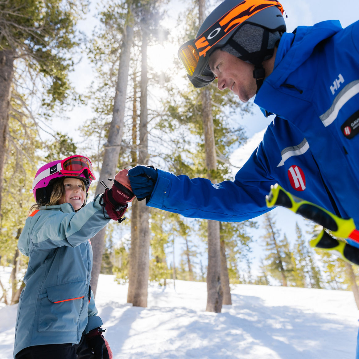 Older children skiing with an instructor