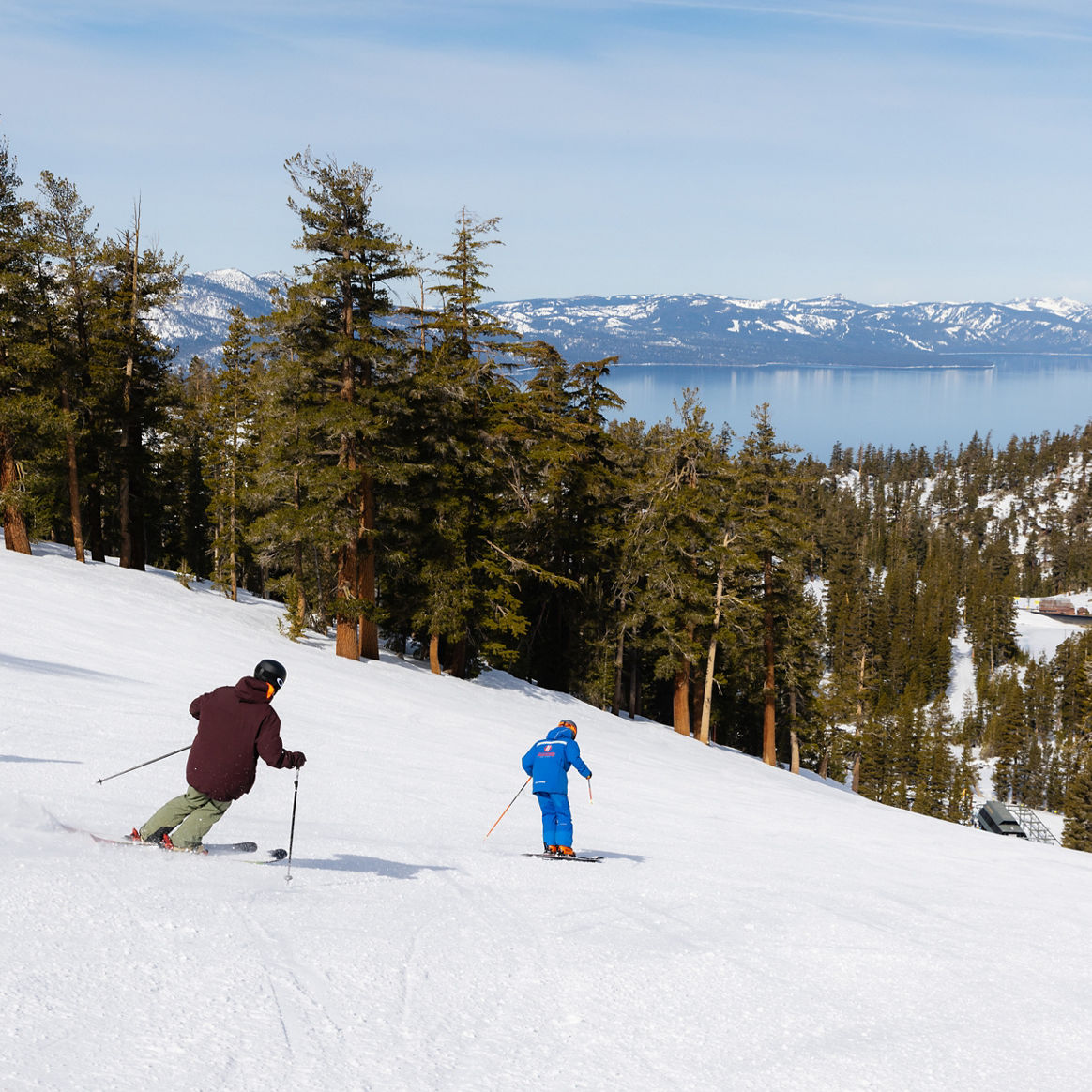 Adults skiing with an instructor