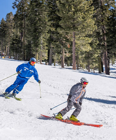 Older children skiing with an instructor
