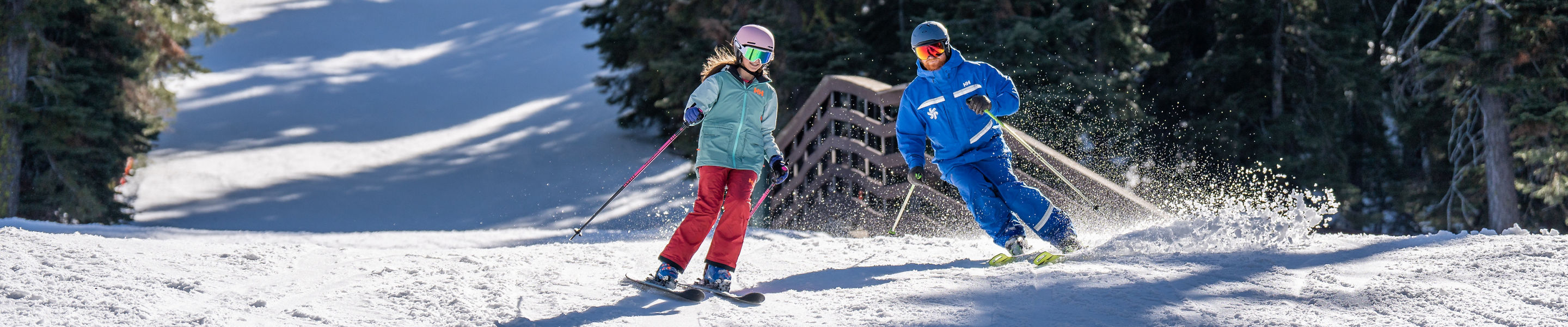 Older children skiing with an instructor