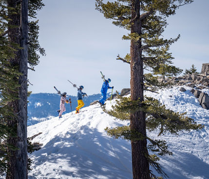 Adults skiing with an instructor