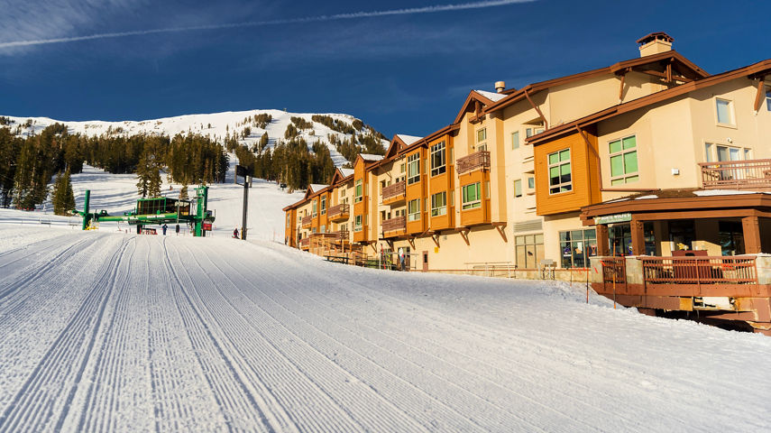 Exterior of a Condo Building next to a Freshly Groomed Ski Run at Kirkwood Mountain Resort