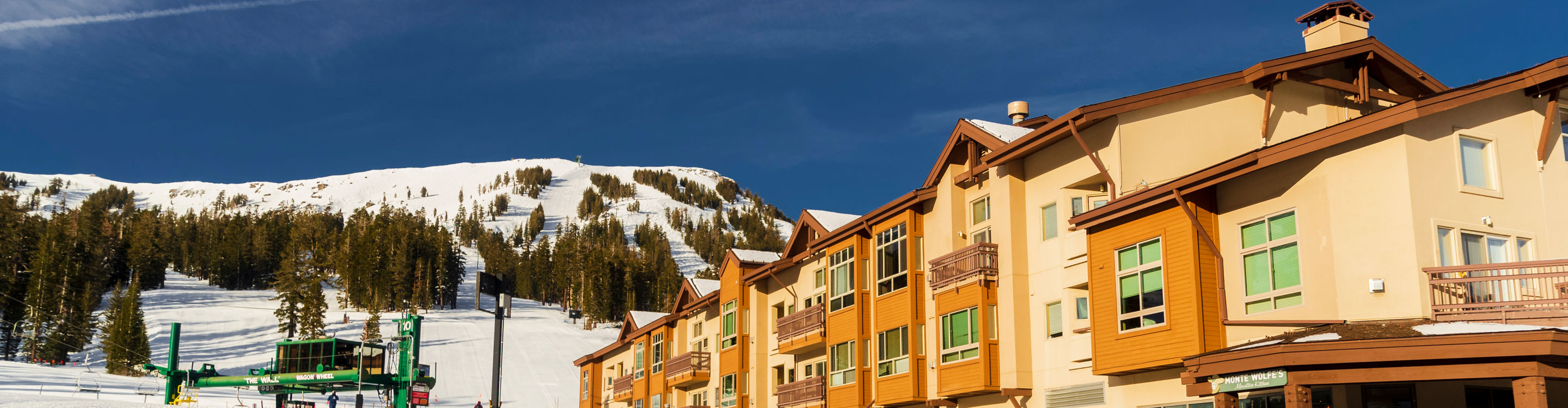Exterior of a Condo Building next to a Freshly Groomed Ski Run at Kirkwood Mountain Resort