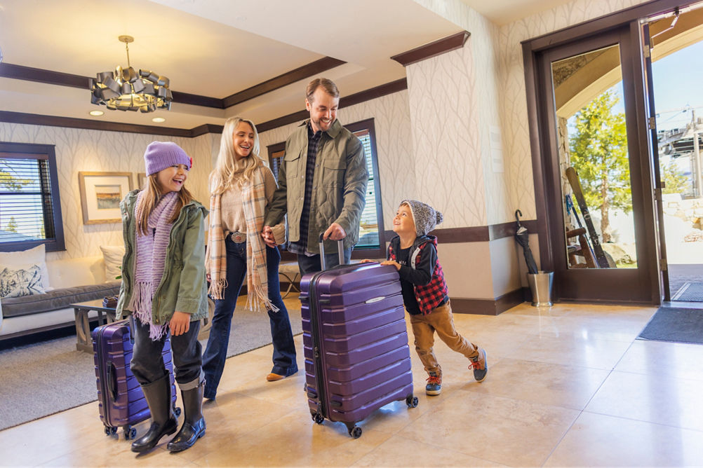 Family walks through lobby at Constellation Residences Northstar