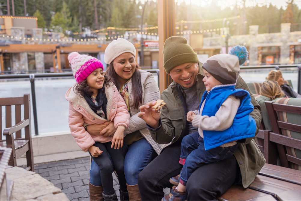 Family has fun around firepits in the Village at Northstar