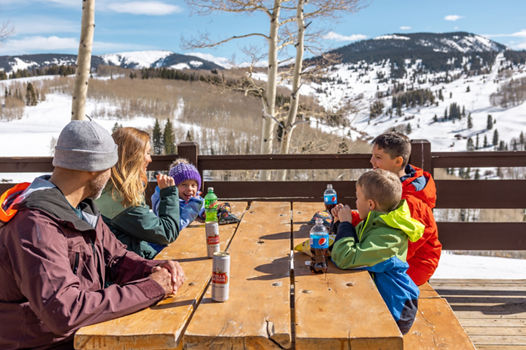 Family Enjoying a Quick Snack at Beaver Creek