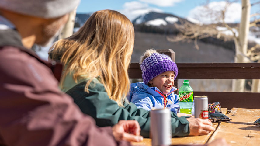 Family Enjoying a Quick Snack at Beaver Creek