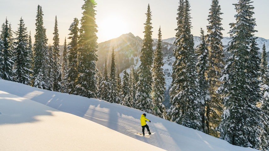 Josh Snowboarding on a Beautiful Morning at Stevens Pass