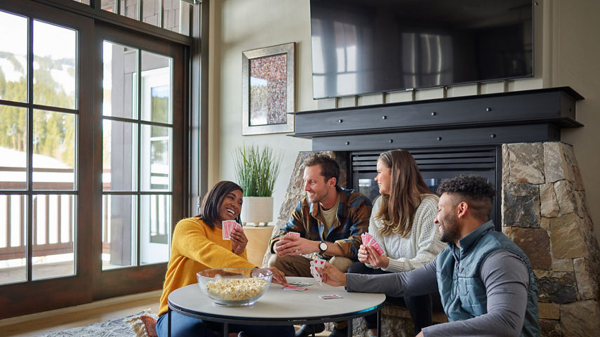 Friends Enjoying Food and Drinks in Room at One Ski Hill at Breckenridge Resort