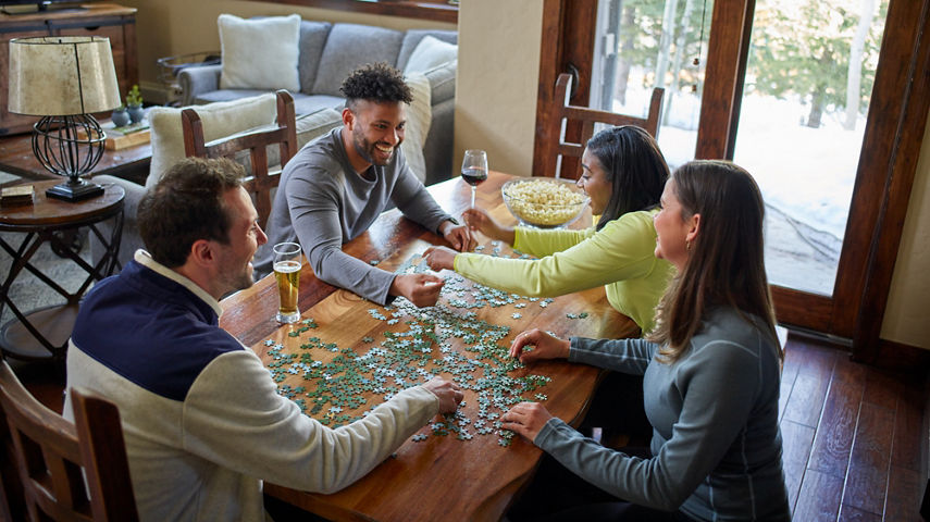 Friends Making a Puzzle at Mountain Thunder Lodge in Breckenridge