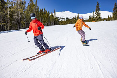 Friends ski and snowboard Peak 7 groomer bluebird day spring