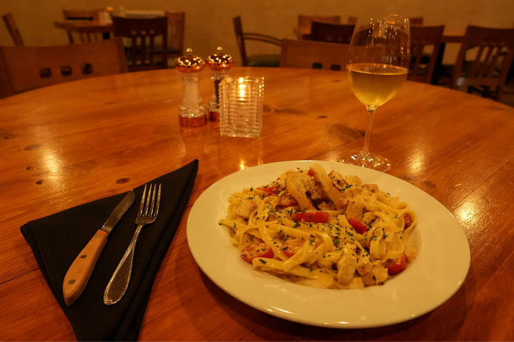 Pasta and Wine on Table at Harriman's Pub & Kitchen