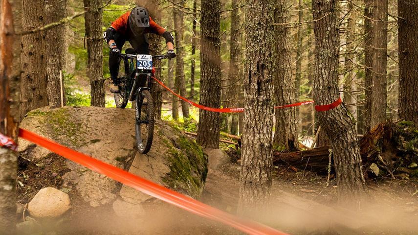 Mountain Biker Running a Course at the Bike Park in Whistler