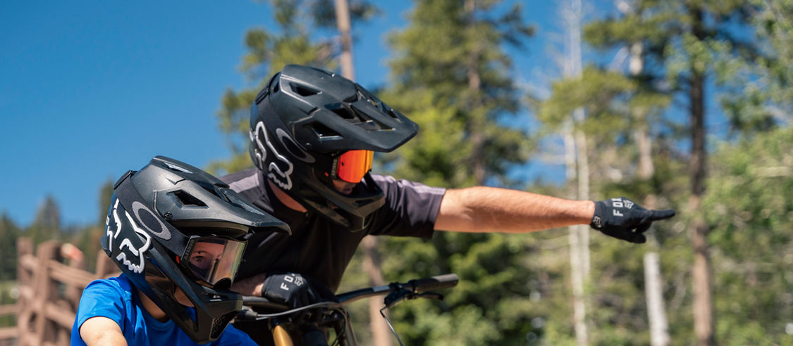 Family reads trail signs at Northstar Bike Park