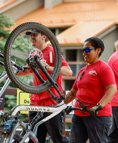 Crested Butte Bike Park employees loading bikes on the Red Lady Express
