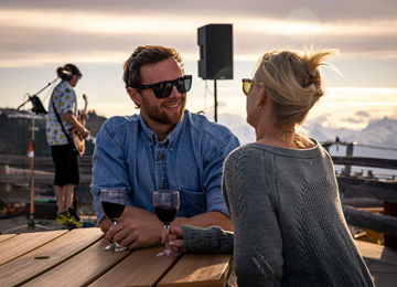 Couple drinking wine at the Mountain Top Feast 