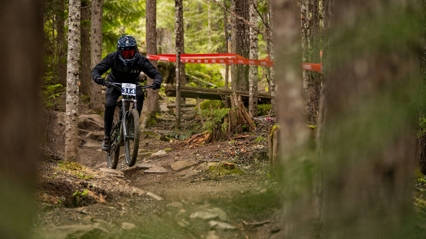 Mountain Biker Running a Course at the Bike Park in Whistler