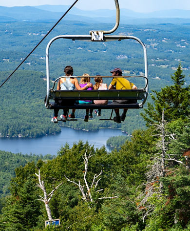 Family Takes in Summer Scenic Views at Mount Sunapee While Riding Chairlift