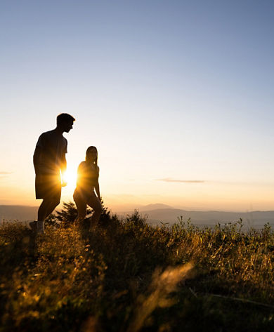 Young Couple Hiking at Mount Sunapee