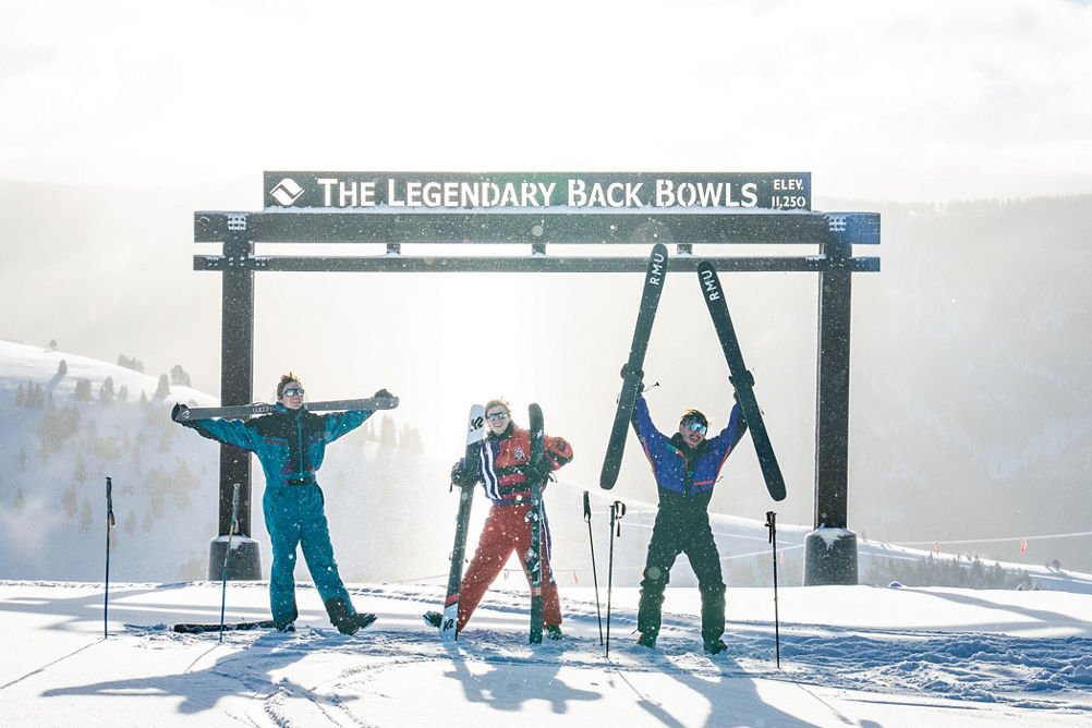 Employees Posing in Front of The Legendary Back Bowls at Vail