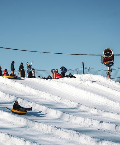 Resort Guests Enjoy Tubing Down Hill at Roundtop