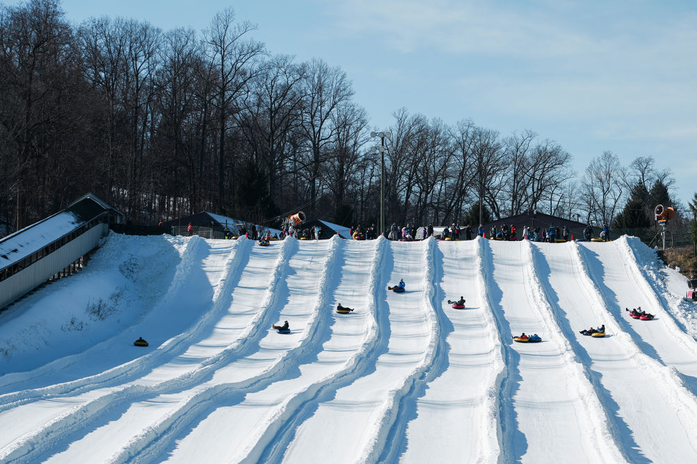 Resort Guests Enjoy Tubing Down Hill at Roundtop