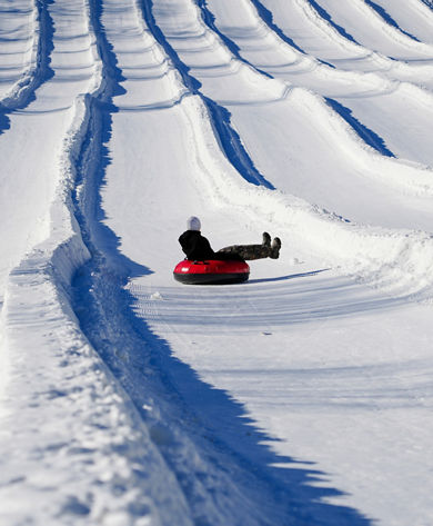 Resort Guests Enjoy Tubing Down Hill at Roundtop
