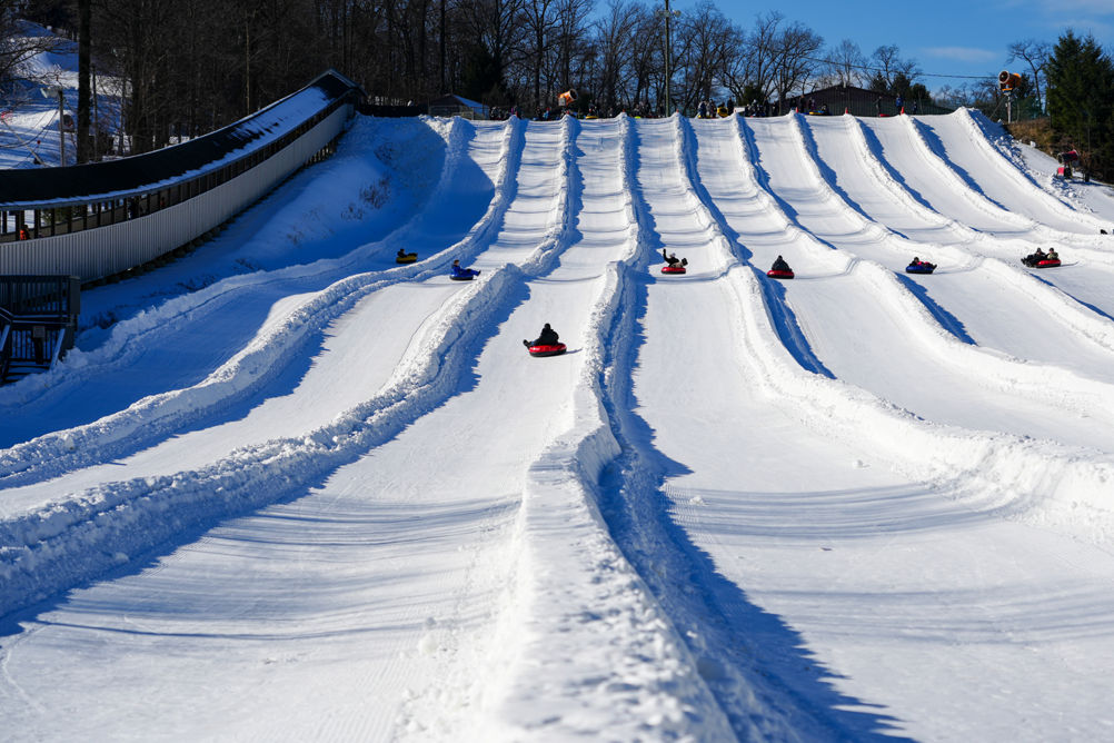 Resort Guests Enjoy Tubing Down Hill at Roundtop