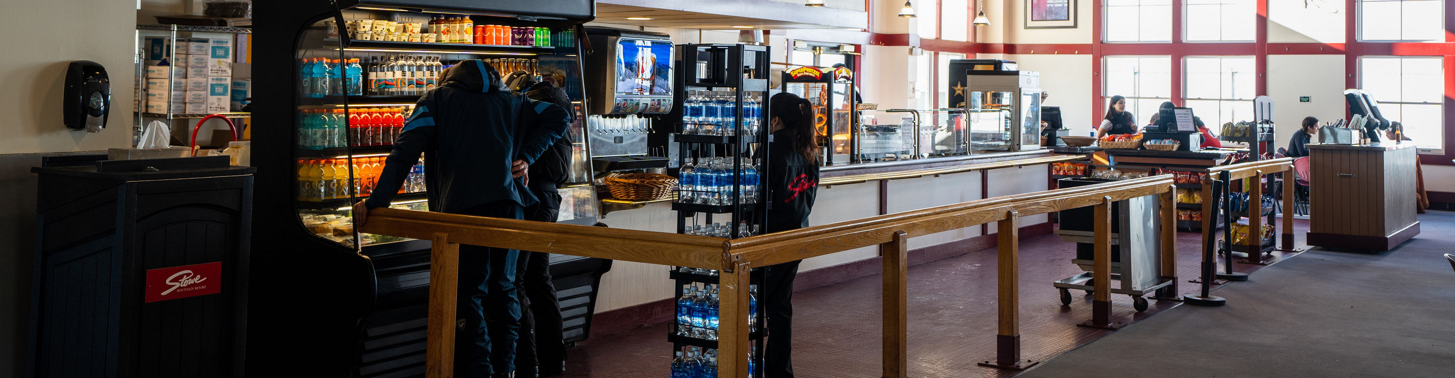 Guests Look at Grab and Go Lunch Options at Stowe Midway Cafe