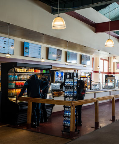 Guests Look at Grab and Go Lunch Options at Stowe Midway Cafe